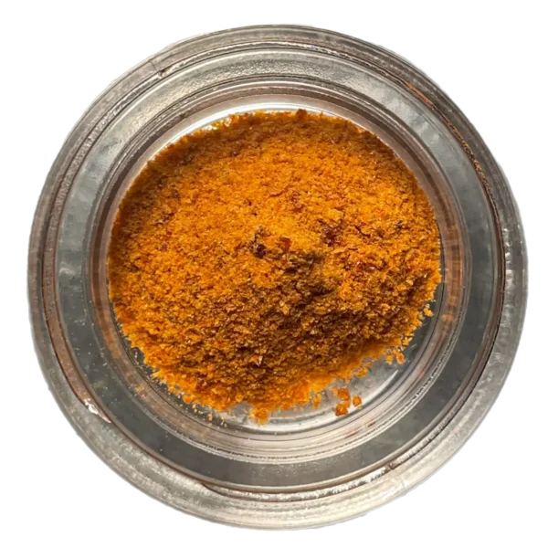 jar of orange colored cordyceps crystals
