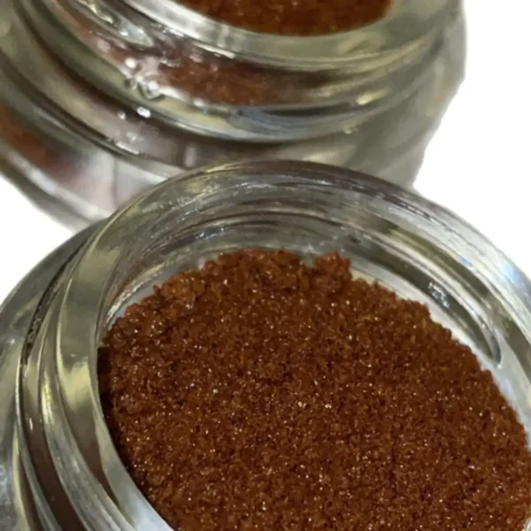 two jars of brown colored lions mane crystals
