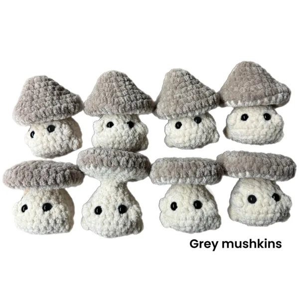 variety of assorted crochet mushrooms made with grey polyester