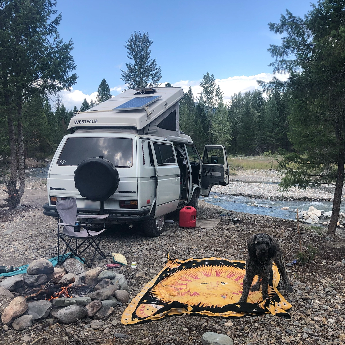 Drews bog buddy standing in front of a white westfalia vanagon