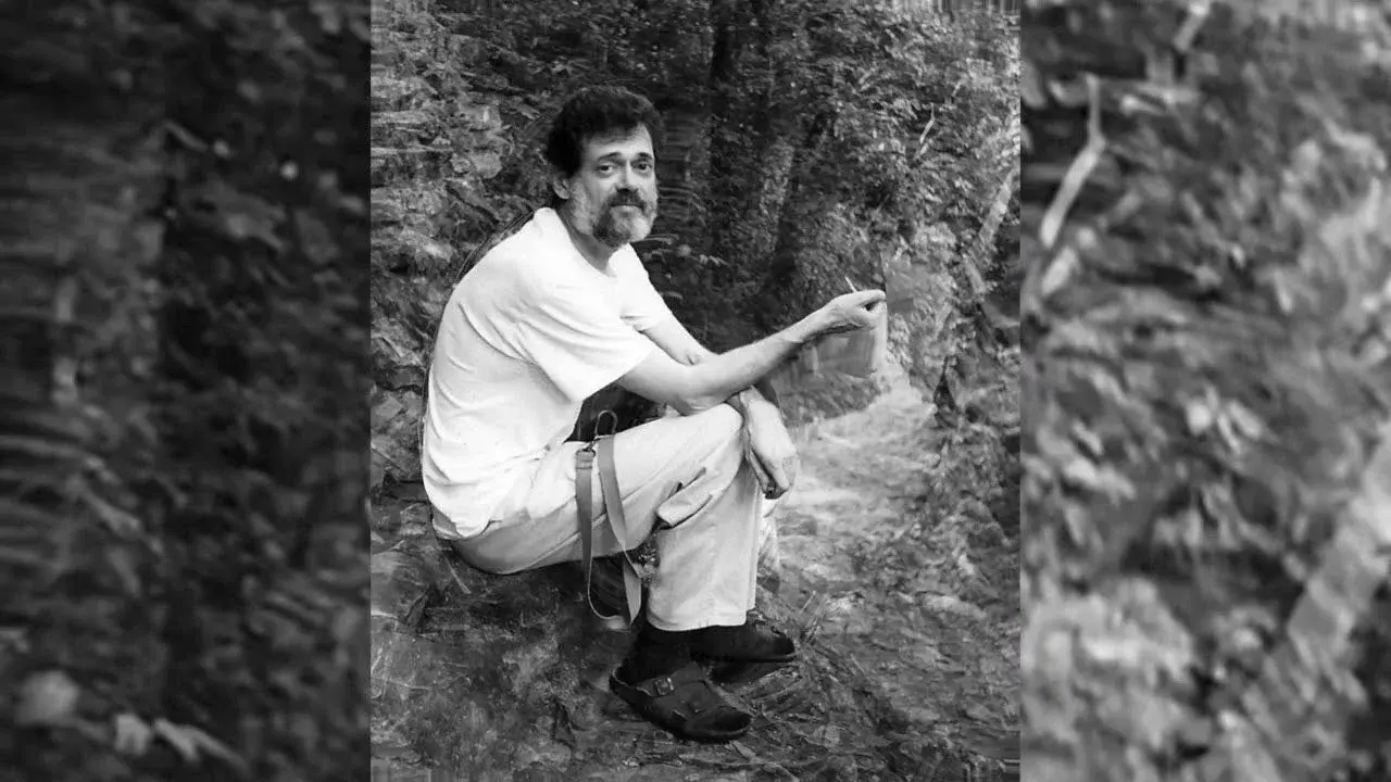 terence_mckenna_archive_itw an image from the terence mckenna archive of tm sitting under a tree in a white t shirt