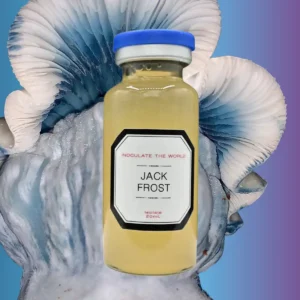 A small vial with yellow liquid in front of a blue and white Jack Frost mushroom